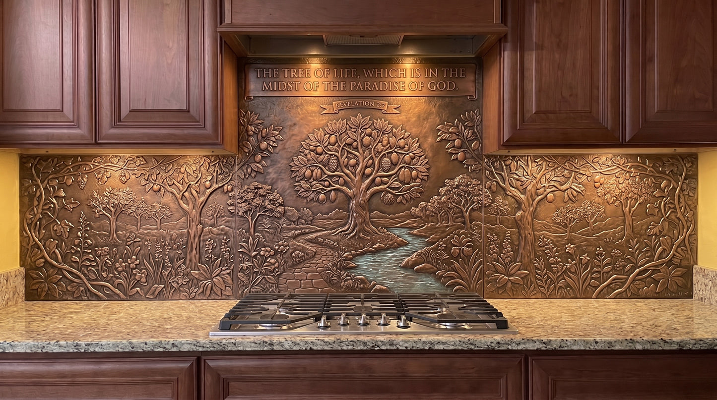 Tree of Life Through the Garden copper kitchen backsplash inspired by Revelation 2:7, showing a distant spreading Tree of Life approached through layered garden vegetation, smaller trees, and a path or stream, with the landscape worked across the range and under-cabinet panels in raised metal relief.