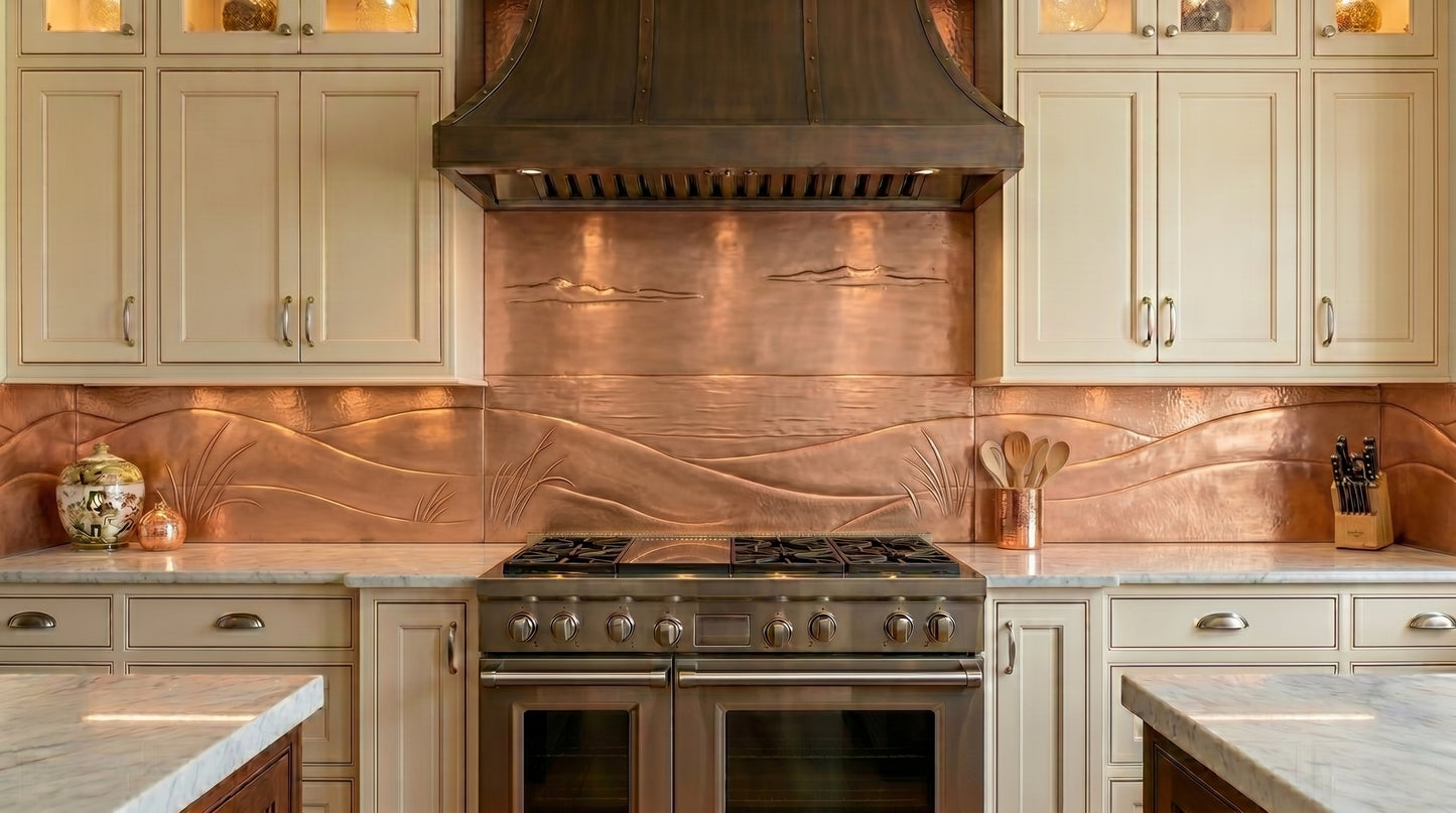 Handmade copper kitchen backsplash featuring flowing dune-inspired landscapes and sculpted horizon details. Custom copper stove backsplash panel crafted from real copper, available in custom sizes and finishes for modern, coastal, farmhouse, and luxury kitchens.