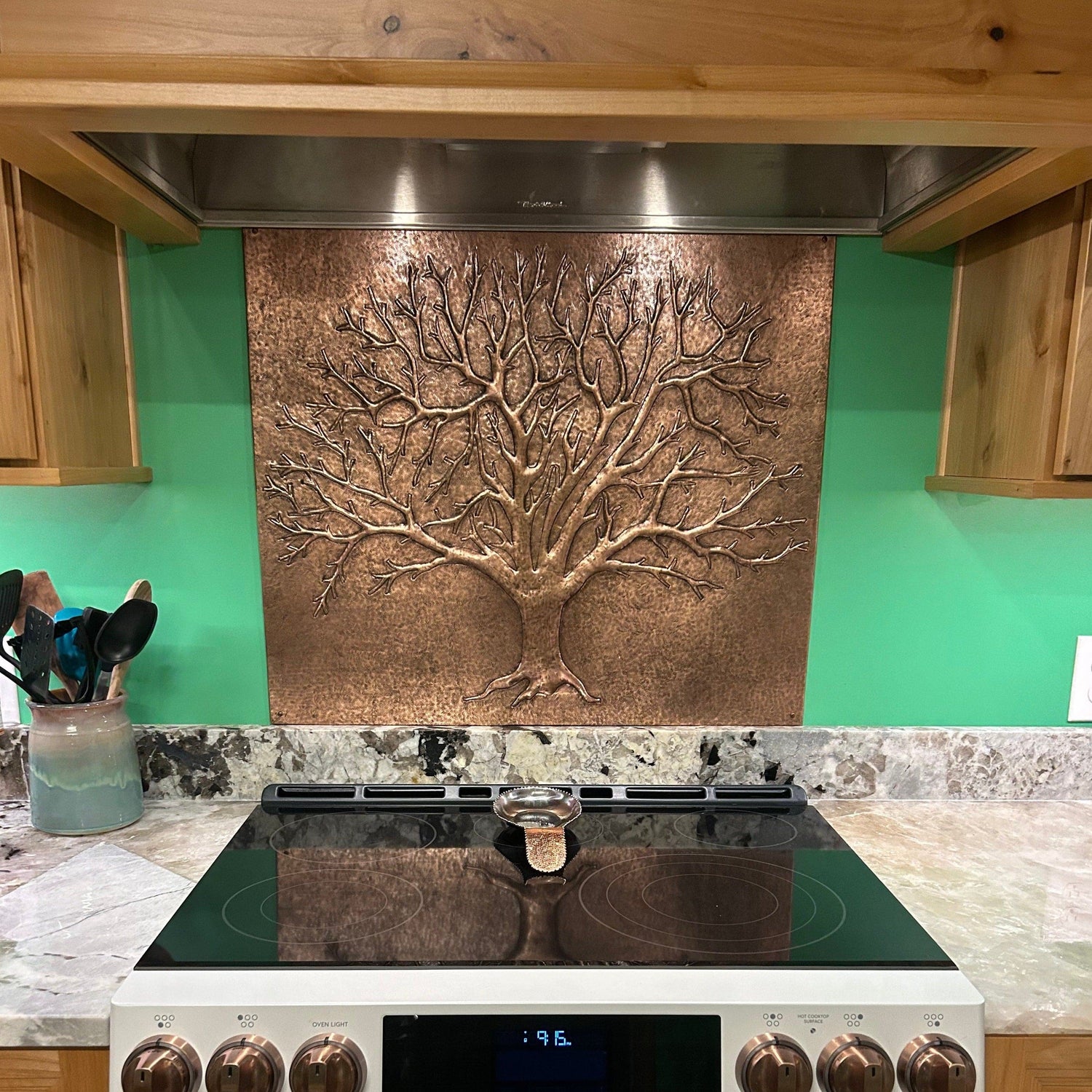 Shop the Tree of Nature Copper Backsplash, a hand-hammered real copper panel featuring a rugged, weathered tree design. Perfect for farmhouse kitchens, lodge interiors, and rustic homes, this artisan copper backsplash brings nature’s raw beauty indoors.