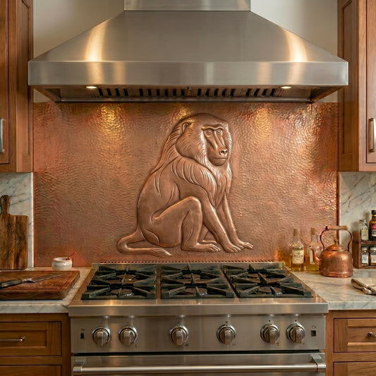 Handmade copper kitchen backsplash featuring a baboon in raised relief. A striking wildlife focal piece inspired by African landscapes, safari lodges, and collectors of exotic animal art.