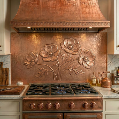 Handcrafted copper stove backsplash featuring elegant Anthurium flowers in repoussé copper. Order a single backsplash panel behind the stove or a complete custom copper kitchen backsplash with matching side panels beneath surrounding cabinets. Available in custom sizes, multiple finishes, and easy installation options.