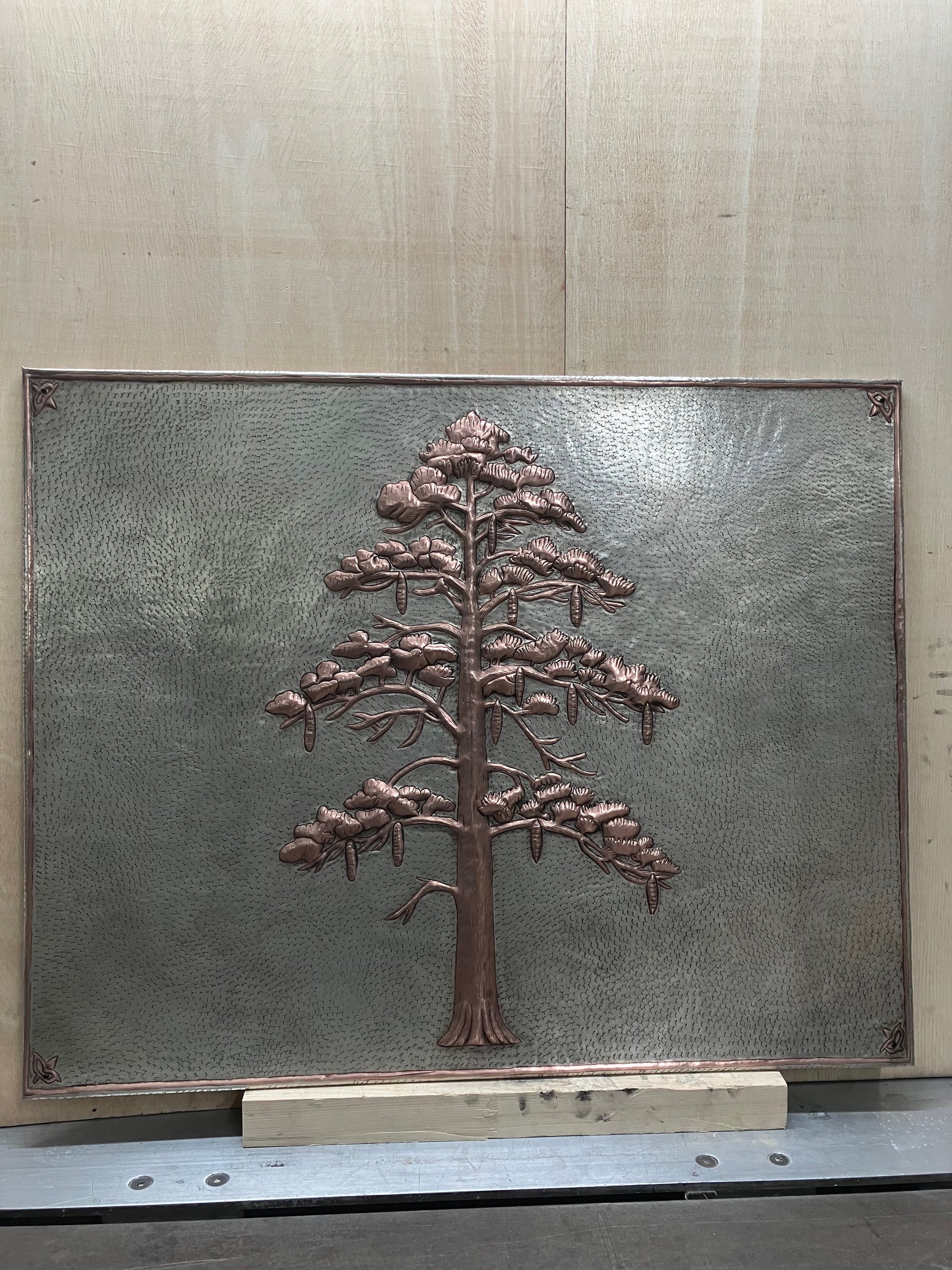 Handmade Eastern White Pine Copper Kitchen Backsplash crafted from real copper. Featuring graceful pine branches and hanging cones. Custom sizes available. Perfect for stove backsplashes, fireplaces, cabins, lodges, and rustic kitchens.