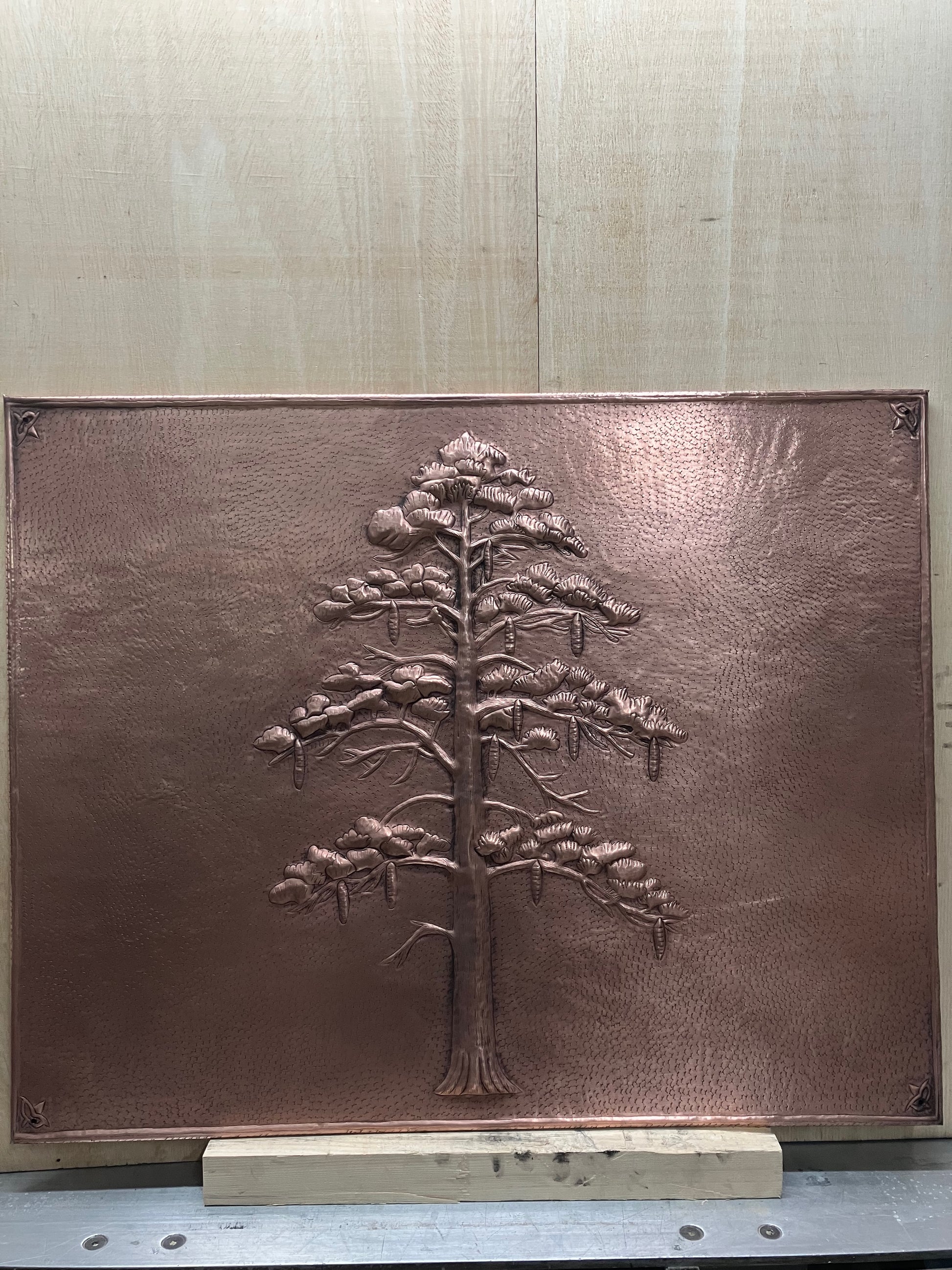 Handmade Eastern White Pine Copper Kitchen Backsplash crafted from real copper. Featuring graceful pine branches and hanging cones. Custom sizes available. Perfect for stove backsplashes, fireplaces, cabins, lodges, and rustic kitchens.