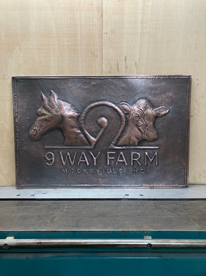 Custom personalized copper kitchen backsplash featuring farm logos, ranch brands, livestock, horses, cattle, family names, and custom artwork. Handmade from real copper in custom sizes and finishes for farmhouse and country kitchens.