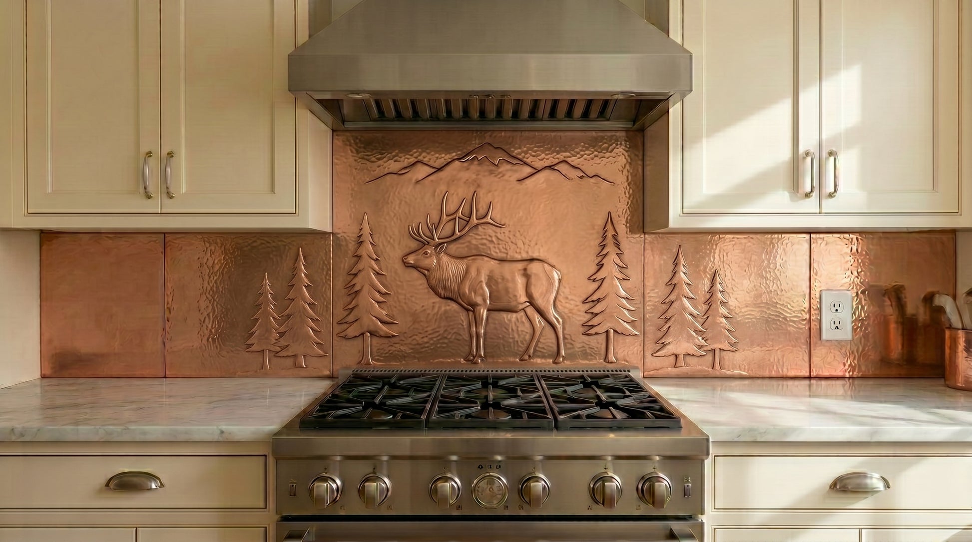 Handcrafted copper stove backsplash featuring a majestic elk, pine forest, and mountain landscape. Real copper kitchen backsplash panels custom made in any size with multiple finish options.