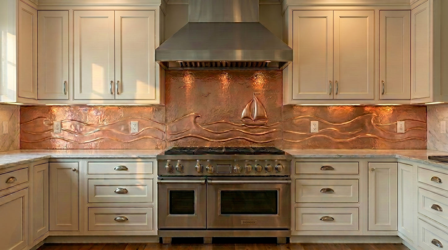Handcrafted sailboat copper single-wall kitchen backsplash featuring flowing ocean waves and nautical coastal artwork. Custom made from real copper for luxury kitchens, beach homes, and waterfront interiors.