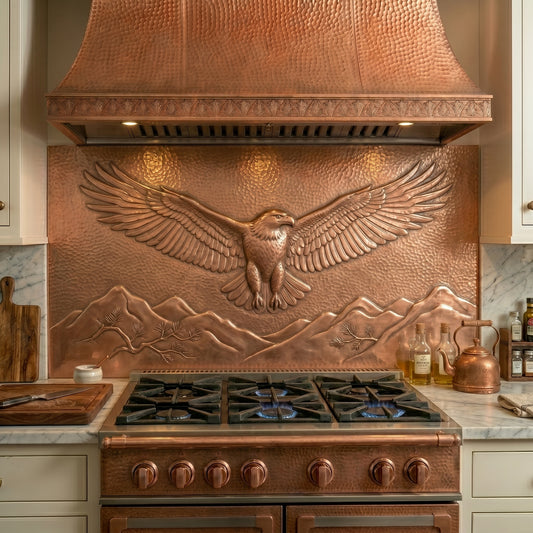 Handmade soaring eagle copper kitchen backsplash for behind the stove. Custom wildlife wall decor featuring a majestic eagle in flight above mountain peaks and wilderness landscapes.