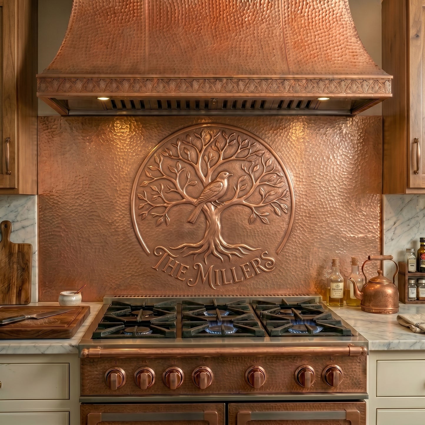 Personalized copper stove backsplash featuring a family tree and songbird design. Handmade copper kitchen backsplash customized with your family name and available in custom sizes.