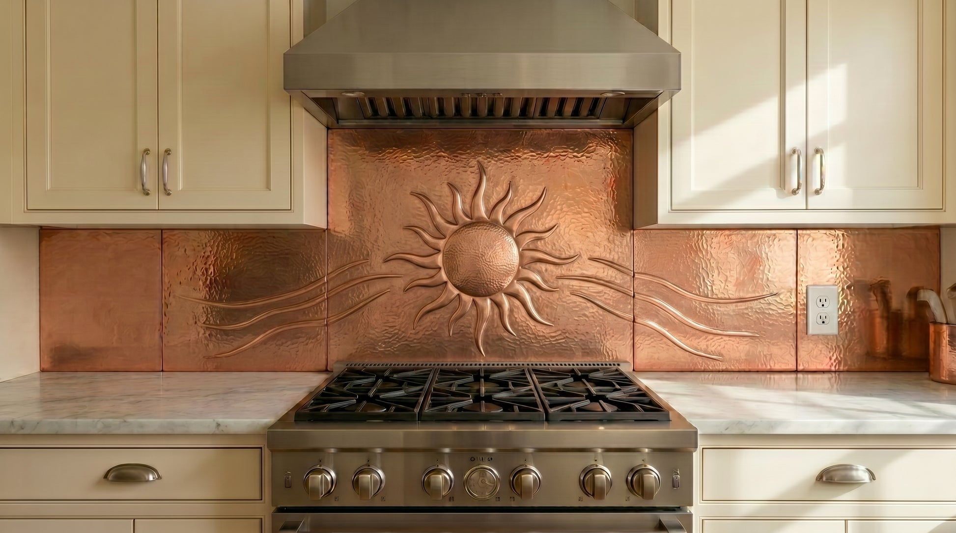 Handmade copper kitchen backsplash featuring a radiant Southwestern sun design. Real copper stove backsplash handcrafted for Santa Fe, ranch, rustic, and Southwestern kitchens. Custom sizes and finishes available.
