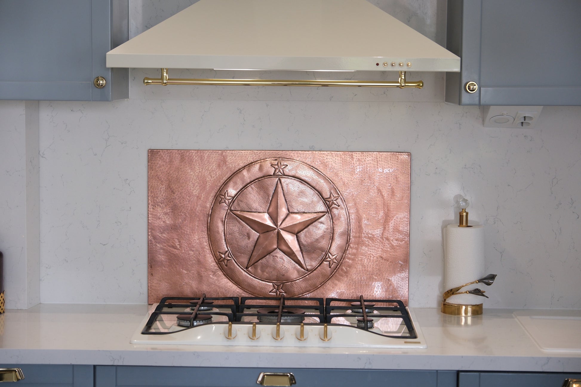Handcrafted copper kitchen backsplash featuring the iconic Texas Lone Star surrounded by a circular star border. Custom copper stove backsplash made from real copper for ranch homes, western kitchens, rustic interiors, and Texas-inspired spaces.