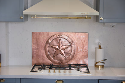 Handcrafted copper kitchen backsplash featuring the iconic Texas Lone Star surrounded by a circular star border. Custom copper stove backsplash made from real copper for ranch homes, western kitchens, rustic interiors, and Texas-inspired spaces.