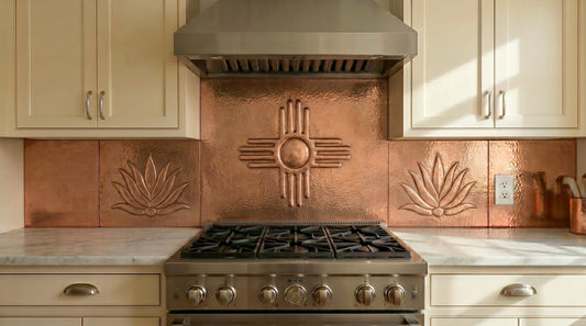 Handcrafted copper stove backsplash featuring the iconic Zia Sun Symbol and agave plants. Real copper kitchen backsplash inspired by Southwestern and Santa Fe design. Custom sizes and finishes available for single panels or complete backsplash installations.