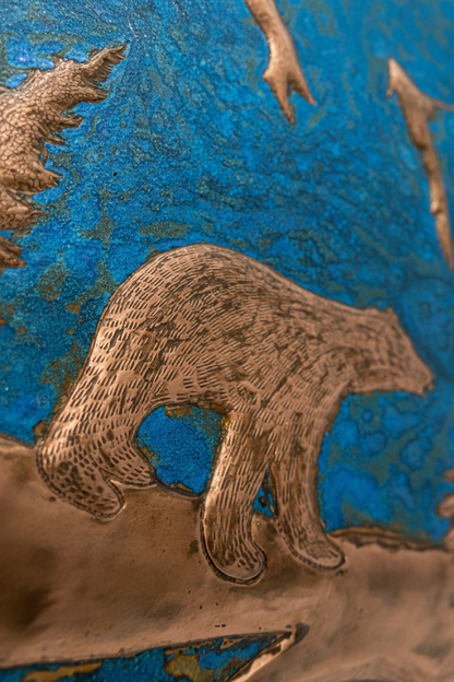Blue Bear backsplash close-up detail showing copper relief on blue patina with hand-hammered texture