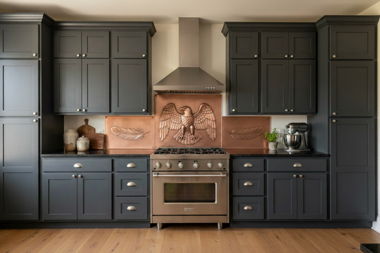 Copper backsplash behind range with bald eagle repoussé design, pure copper, 3-panel set, eagle feather side panels, dark charcoal kitchen