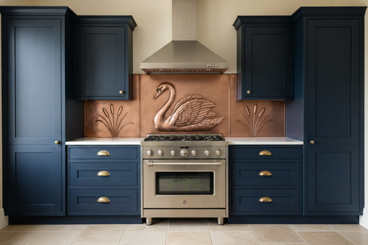 Copper range backsplash with swan repoussé design center panel and cattail reed side panels, 3-panel set, warm brown copper, hand-hammered stipple, dark navy kitchen